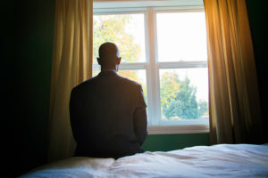 praying man suit window